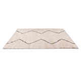 Un tapis oriental beige et noir